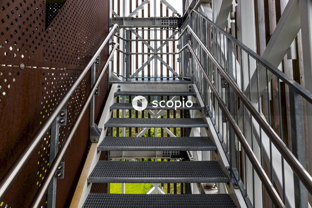 Gray metal staircase on brown concrete building