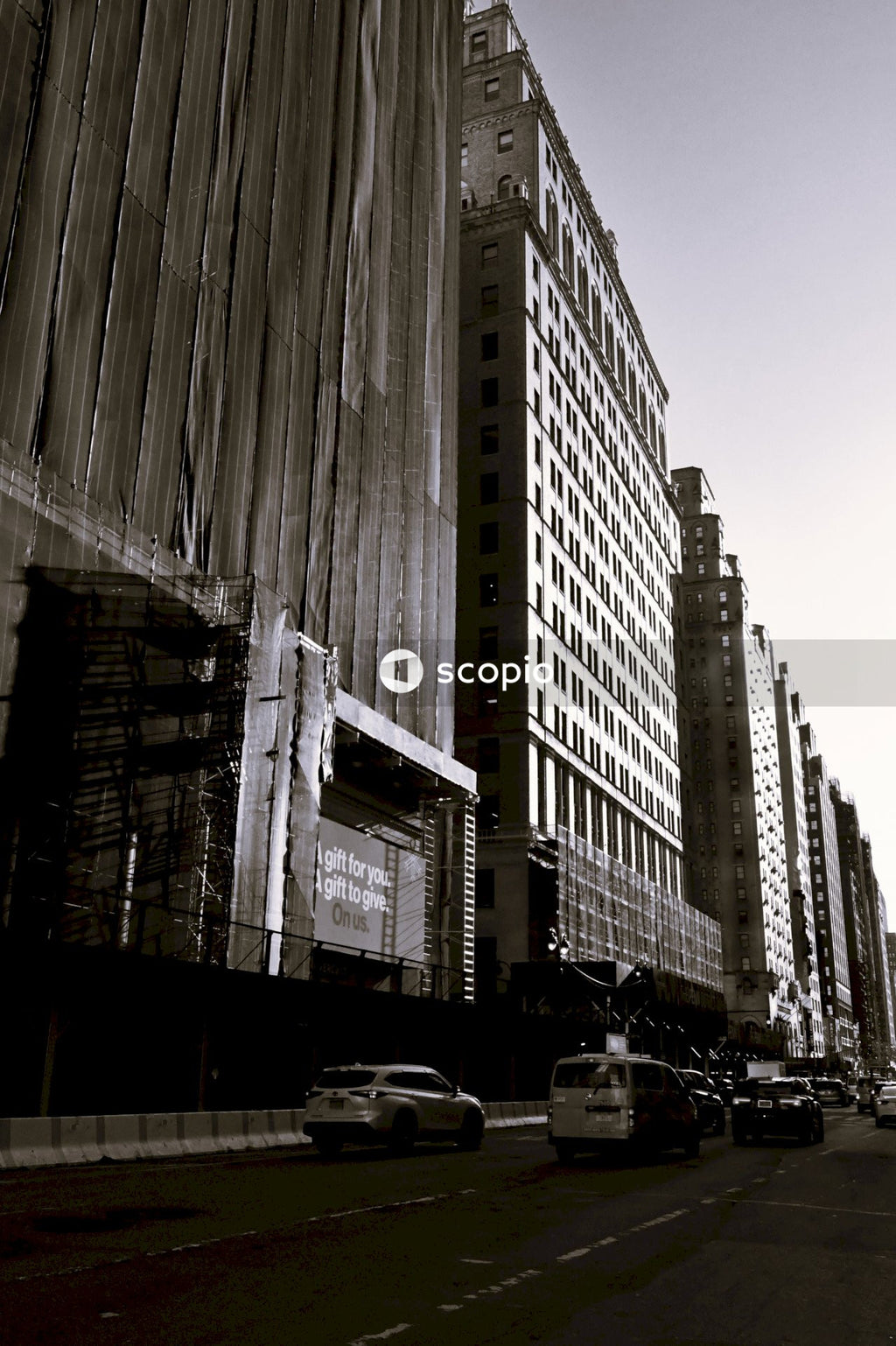 Grayscale photo of city buildings