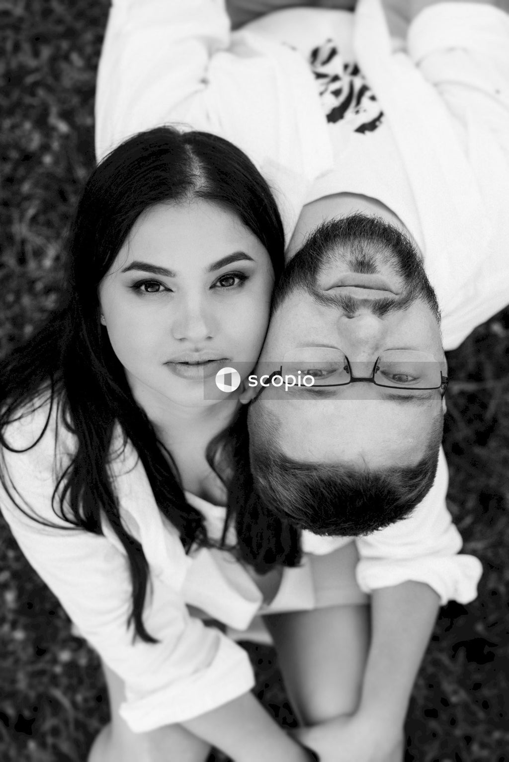 Grayscale photo of couple smiling