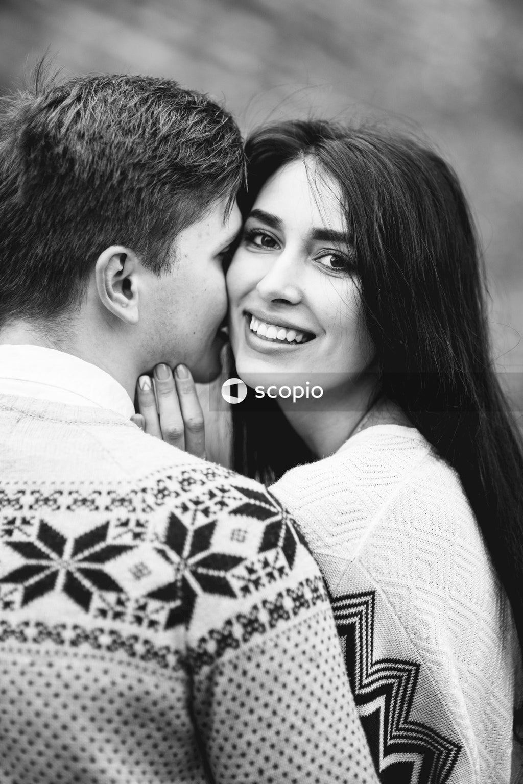 Grayscale photo of couple smiling