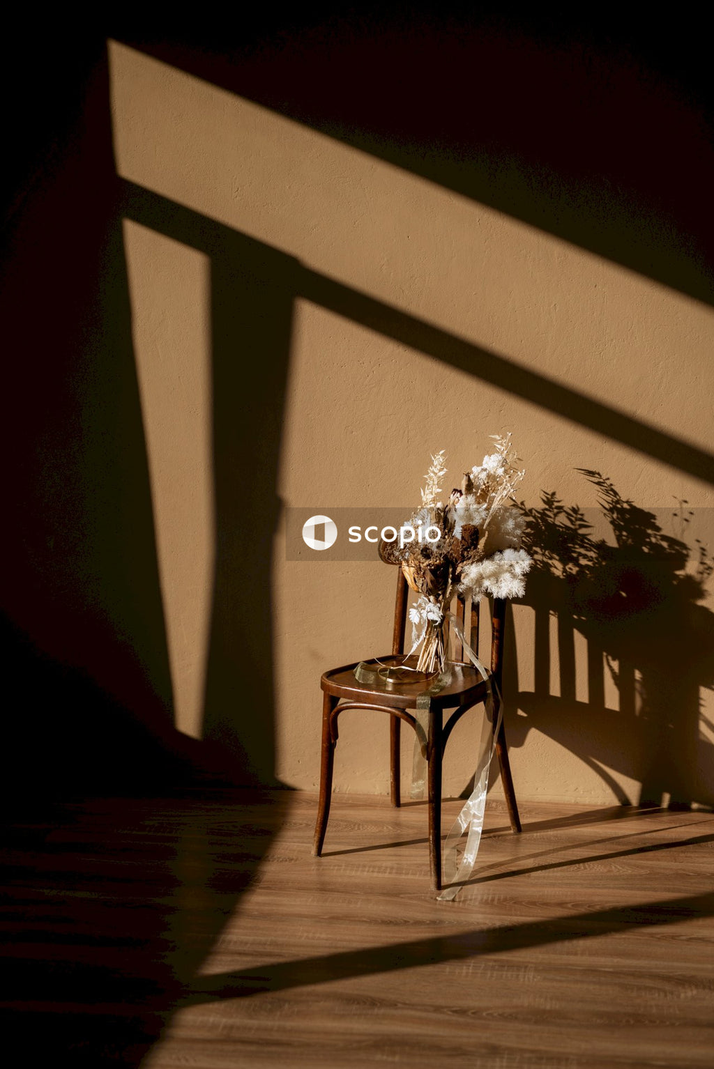 Grayscale photo of flower on table