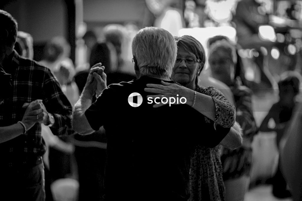 Grayscale photo of man and woman hugging
