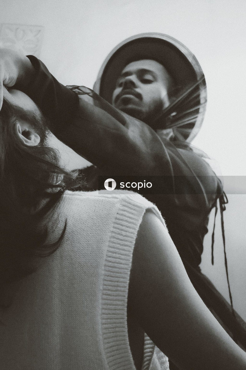 Grayscale photo of two men in romantic moment