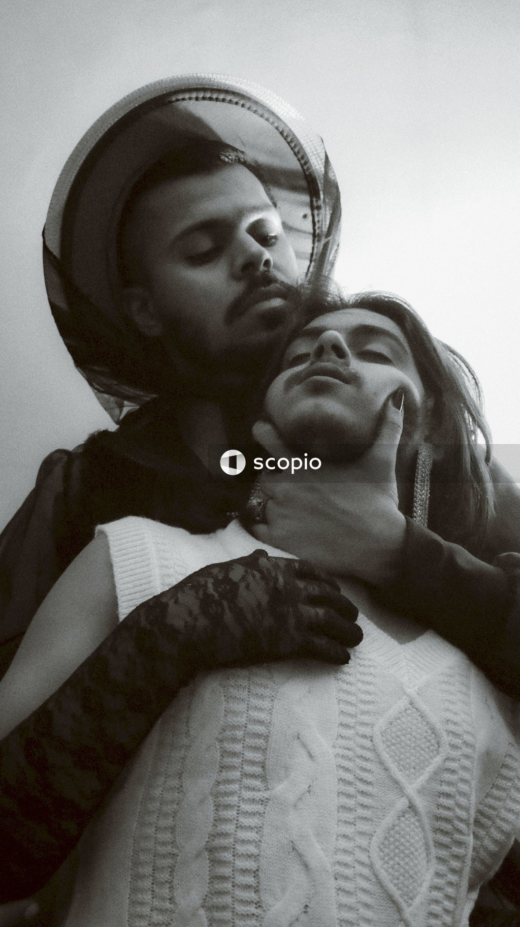 Grayscale photo of two men in romantic moment