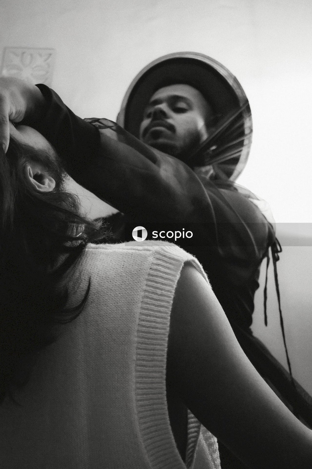 Grayscale photo of two men in romantic moment