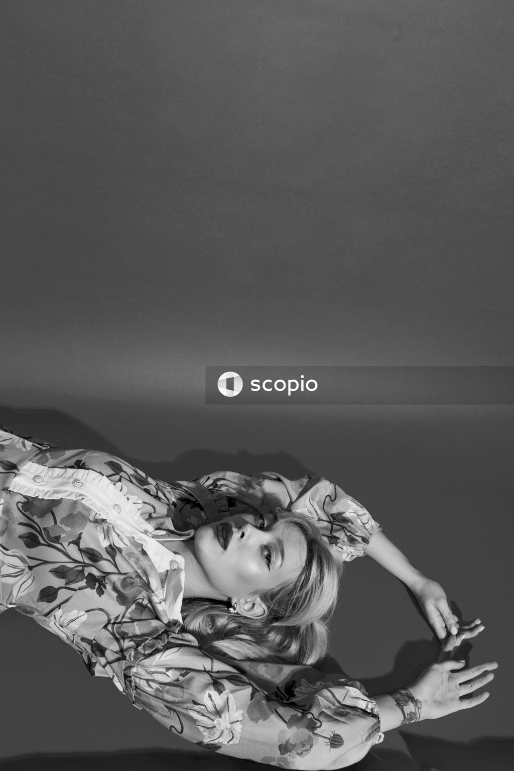 Grayscale photo of woman in floral dress