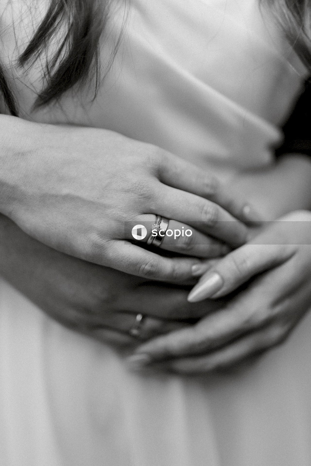 Grayscale photo of woman wearing ring