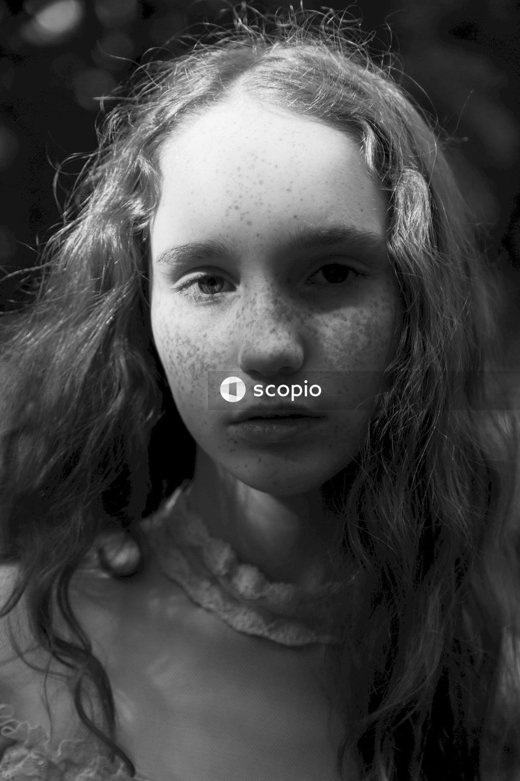 Grayscale photo of womans face