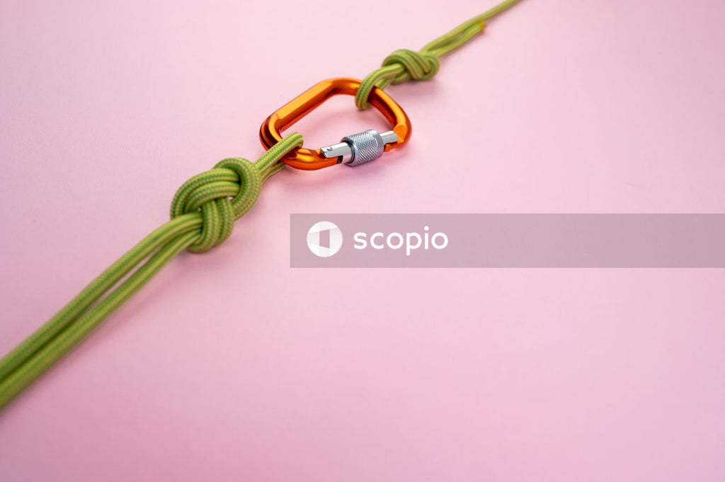 Green and yellow rope on pink surface