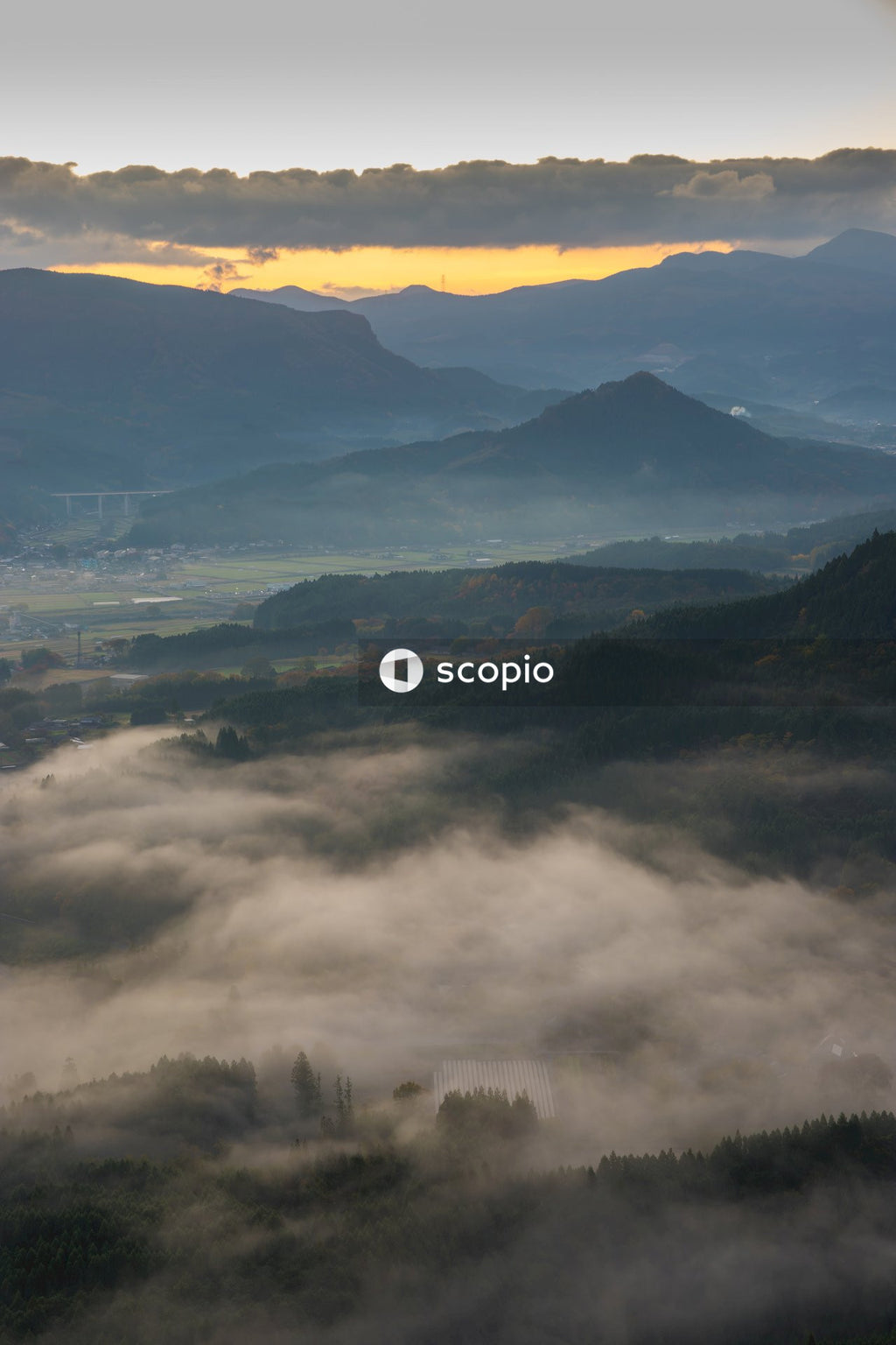 Green mountains under white clouds