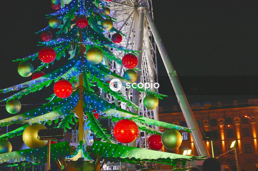 Green red and blue christmas tree with string lights during night time