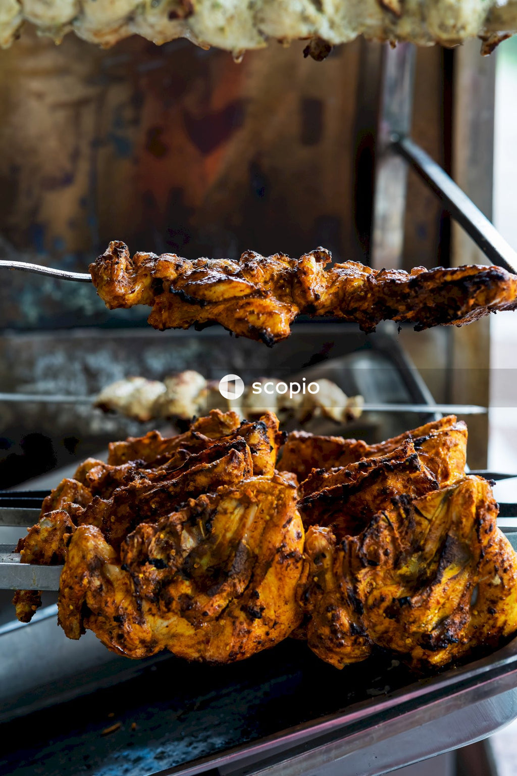 Grilled meat on charcoal grill