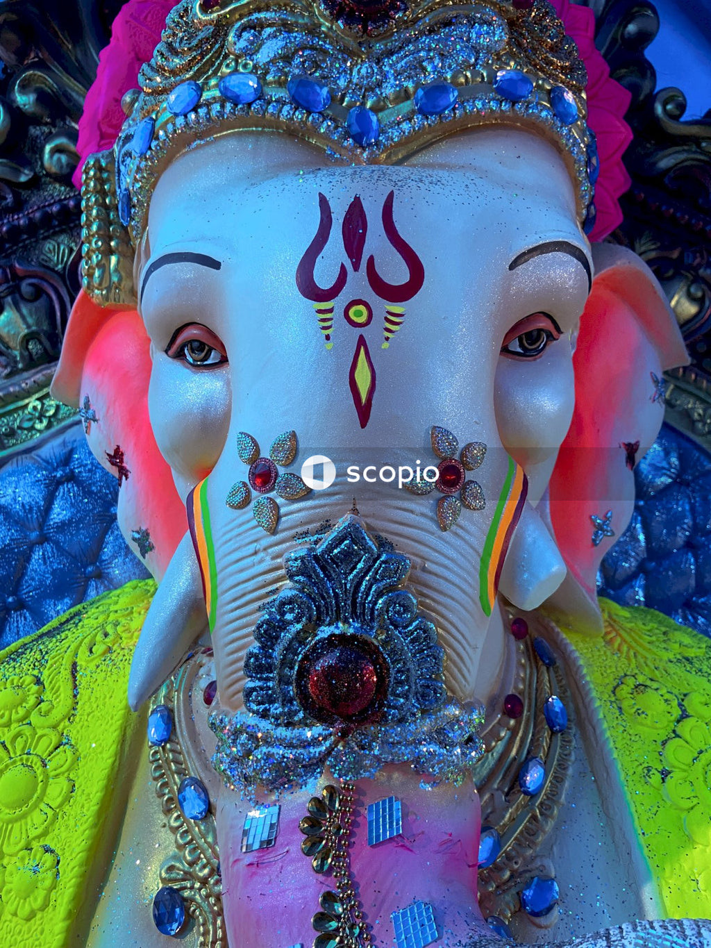 Hindu deity statue with blue and gold crown