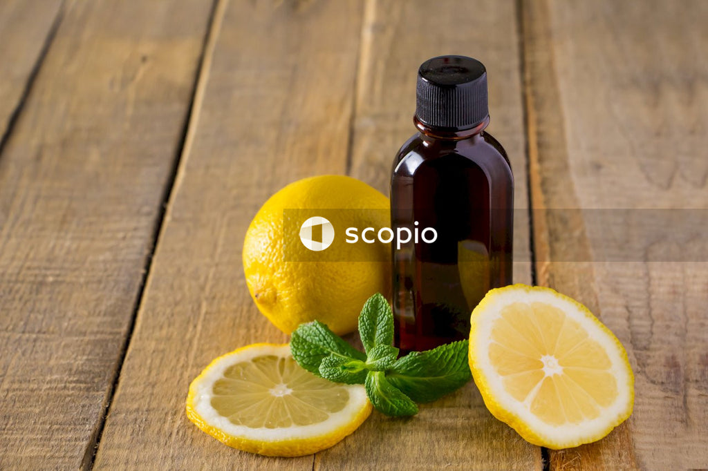 Lemon beside brown glass bottle