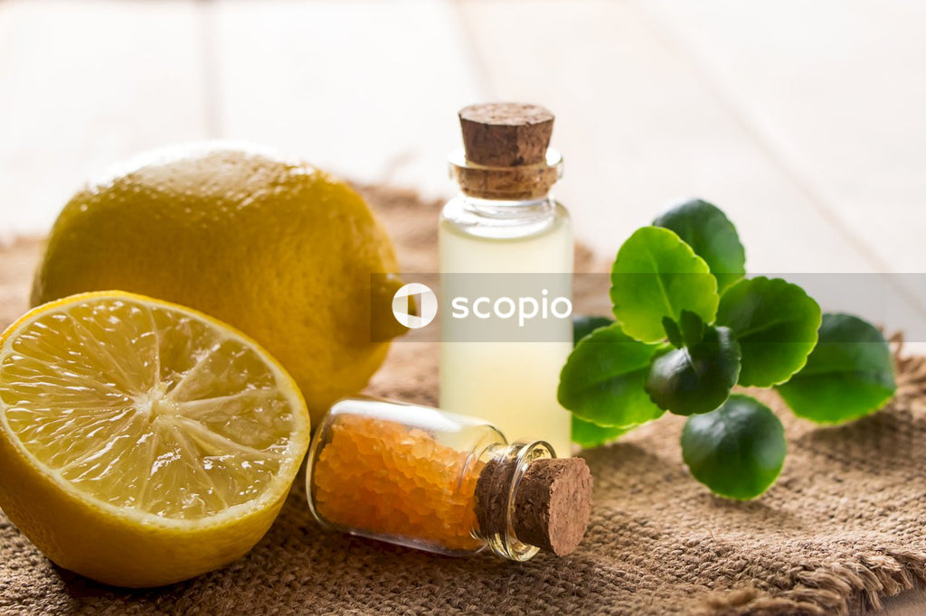 Lemon beside white glass bottle