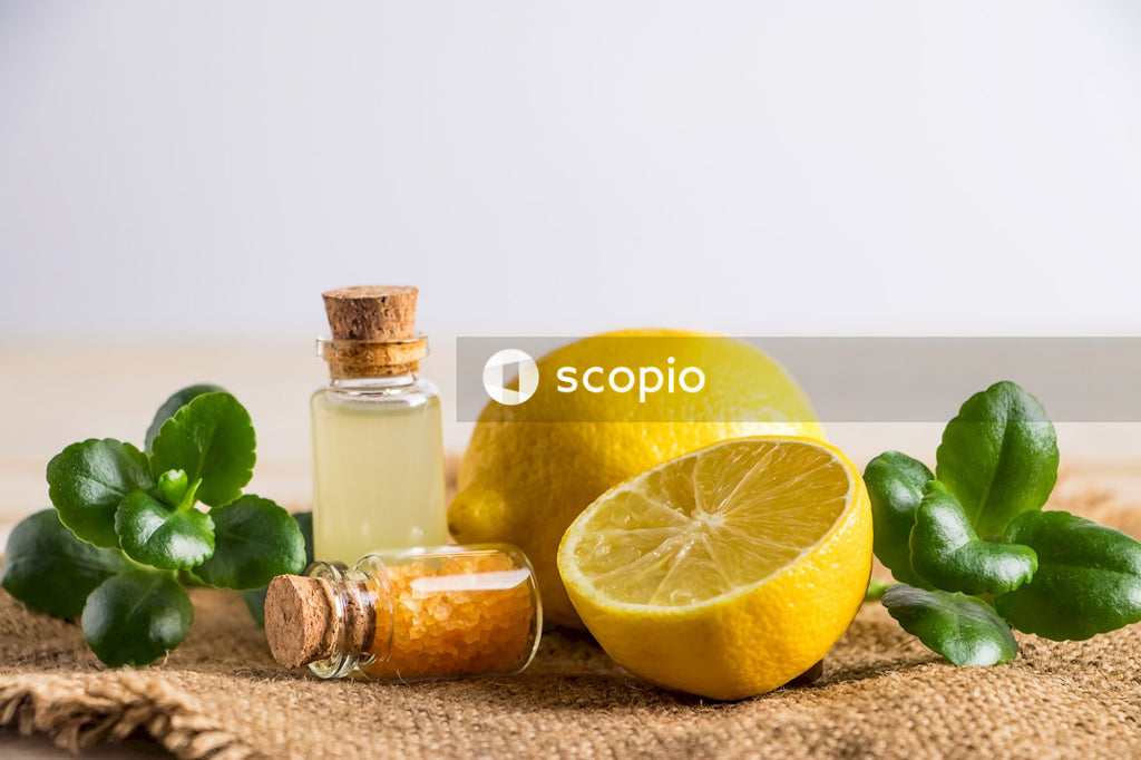 Lemon fruit beside clear glass bottle