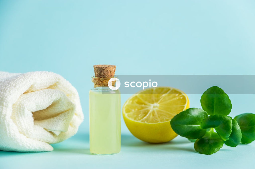 Lemon juice bottle beside white towel