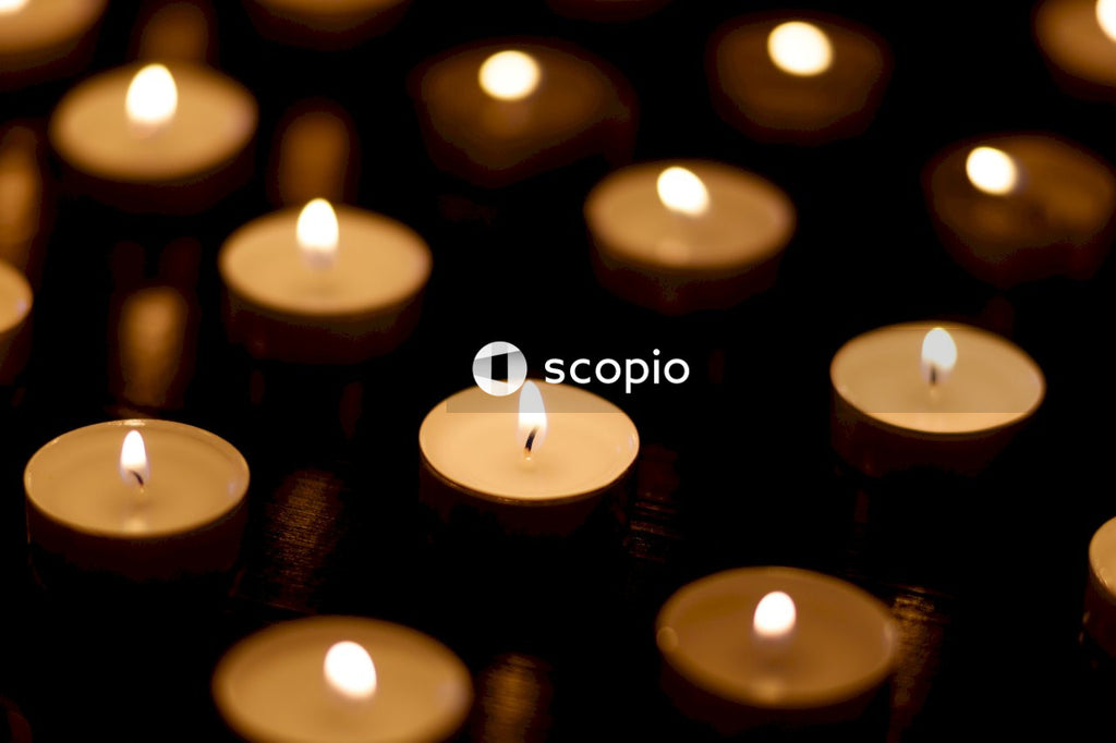 Lighted candles on black candle holder