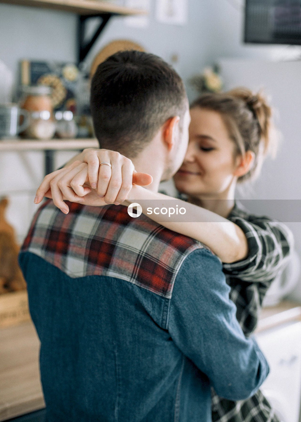 Man and woman about to kiss indoor