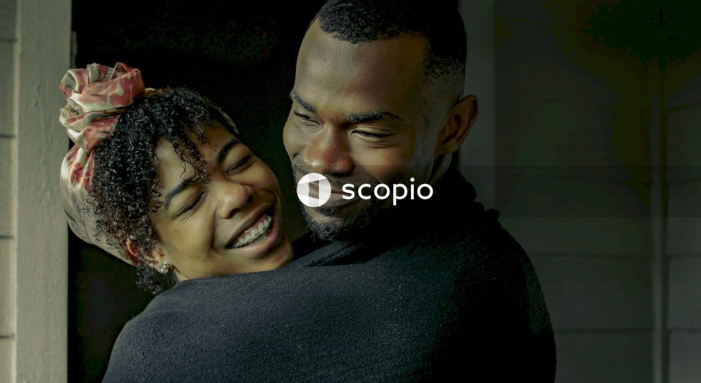 Black couple hugging indoor