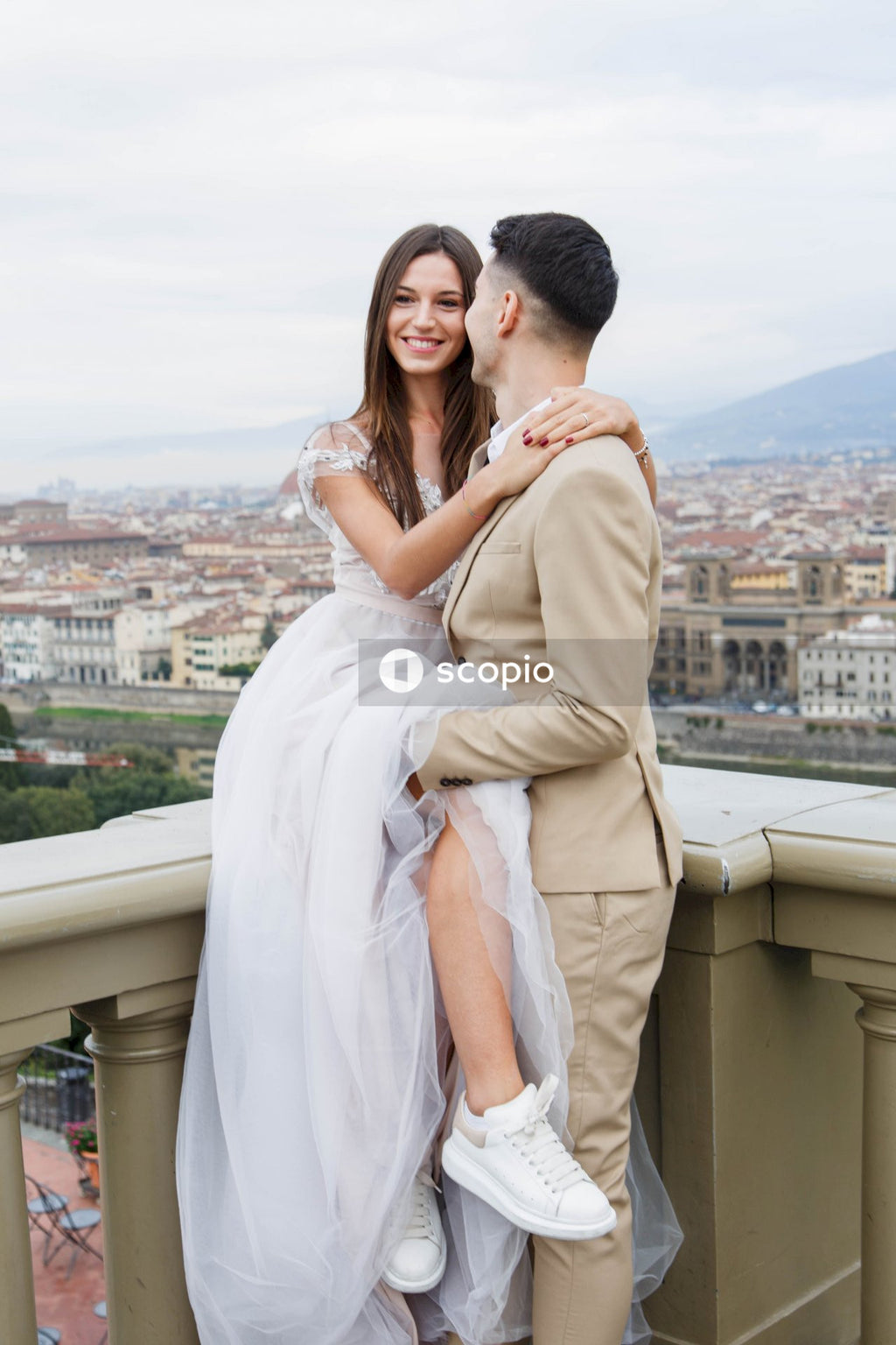 Young couple posing together on the streets in the city