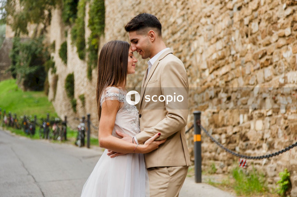 Young couple posing together on the streets in the city
