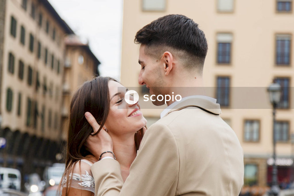 Young couple posing together on the streets in the city