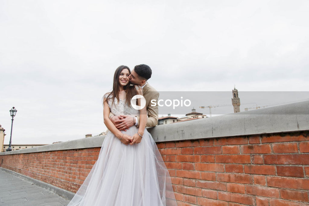 Young couple posing together on the streets in the city