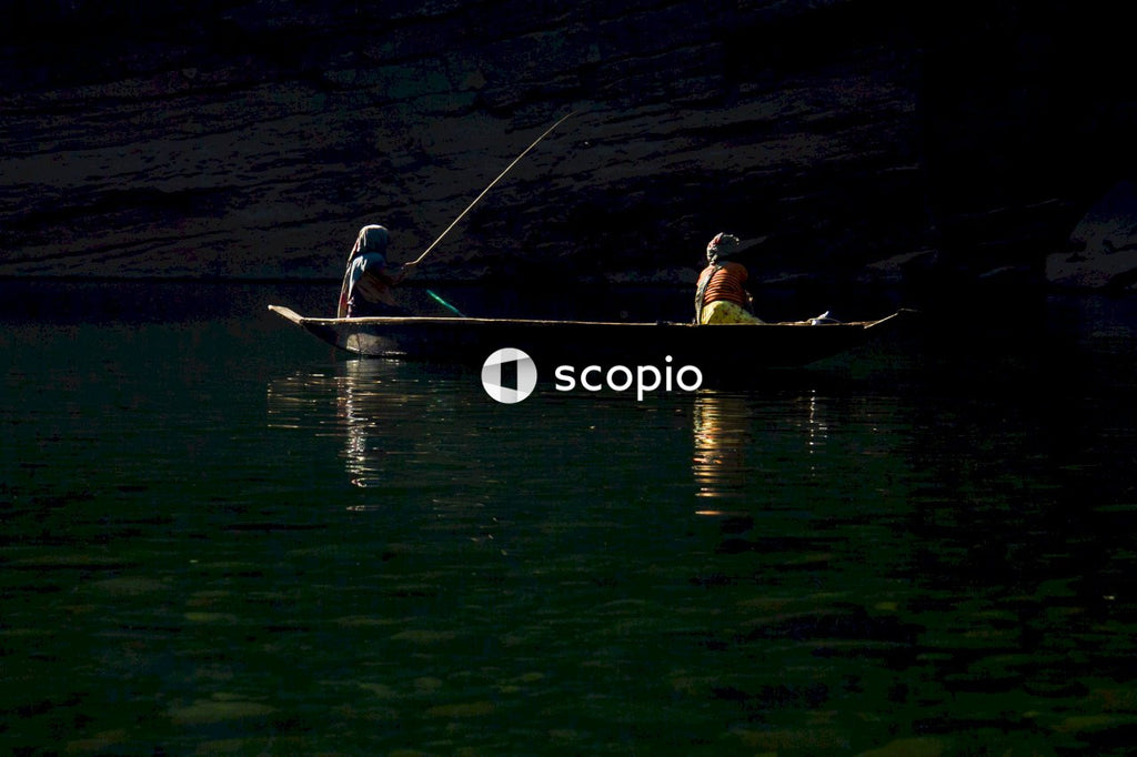 Man and woman riding on boat during night time