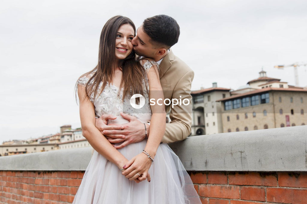 Young couple posing together on the streets in the city
