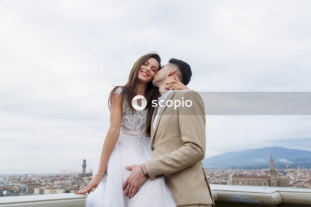 Young couple posing together on the streets in the city