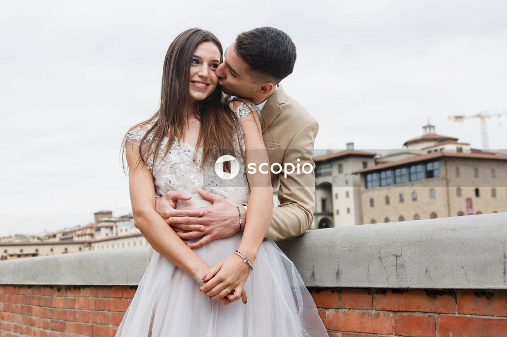 Young couple posing together on the streets in the city