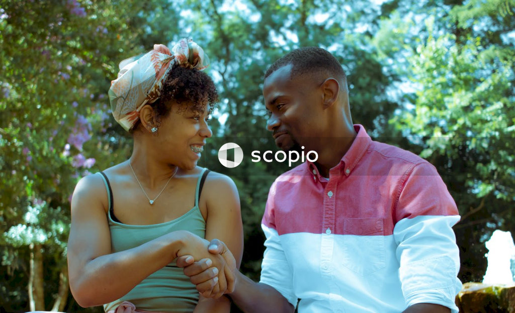 Black woman and Black man shaking hands outdoor
