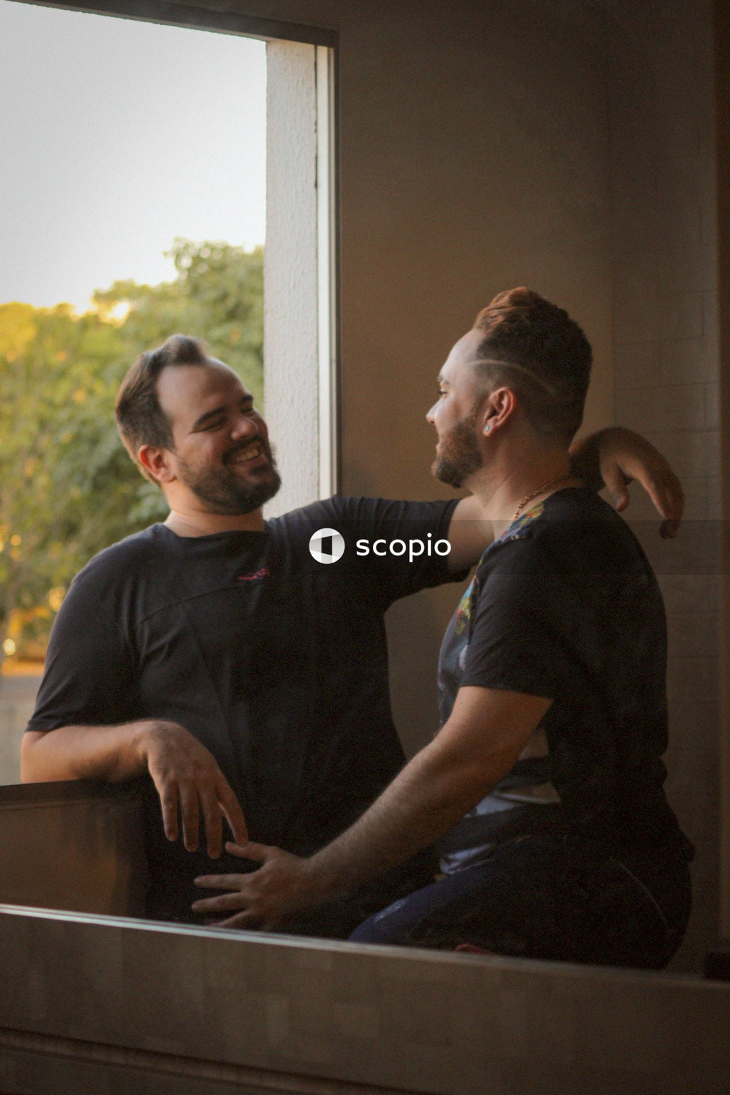 Gay couple smiling at each other