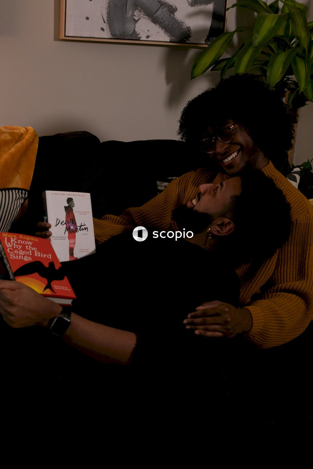 Couple reading books in living room