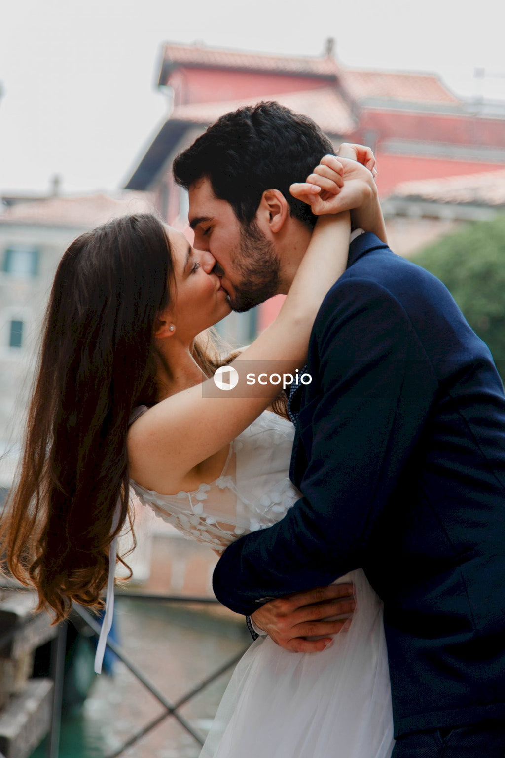 Bride and groom kissing outdoor