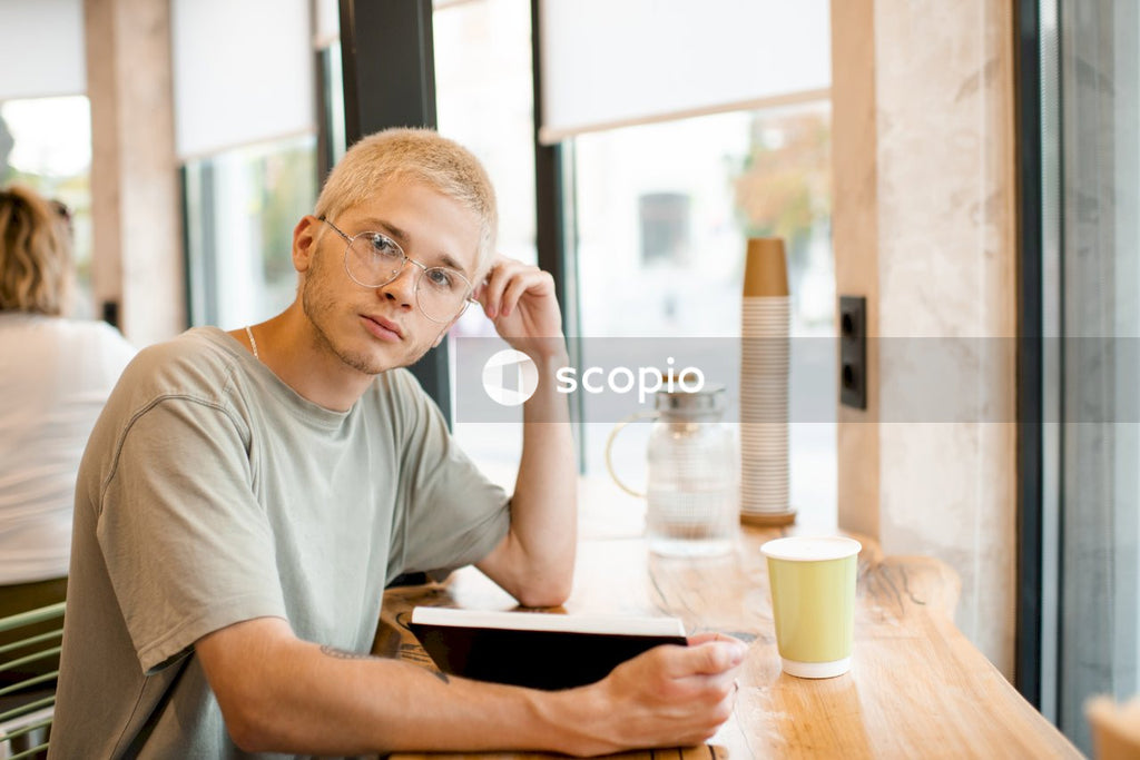 Man in gray crew neck t-shirt sitting at the table