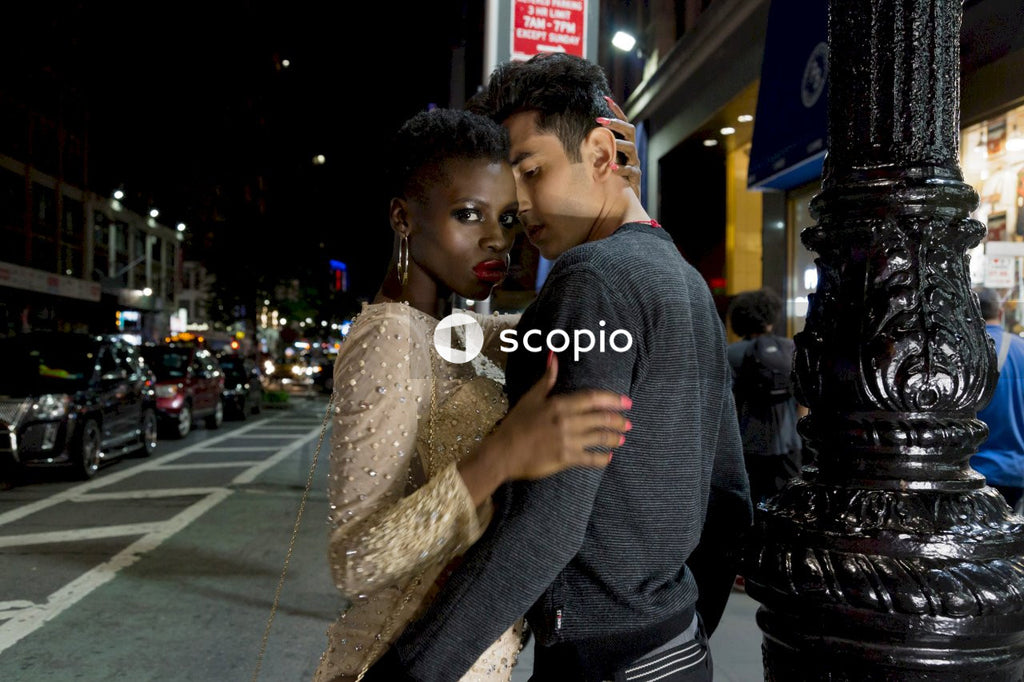 Couple on a date posing on street