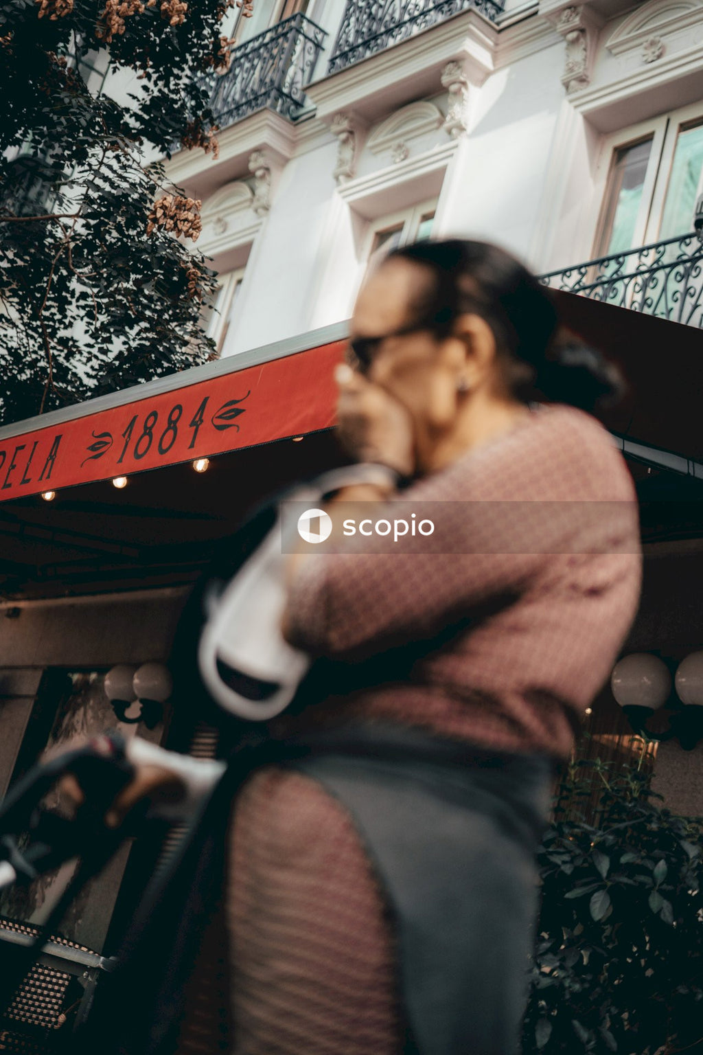 Man in red and white checked dress shirt hugging woman in black and white long sleeve