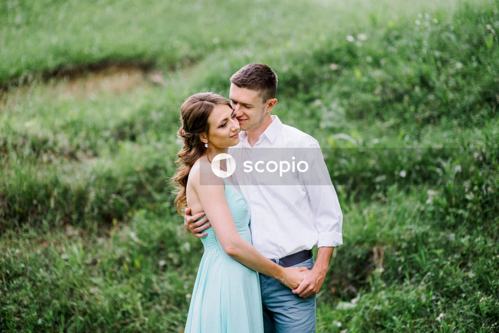 Man in white dress shirt and woman in white dress
