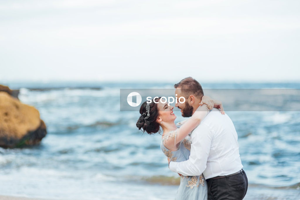 Man and woman hugging on the beach