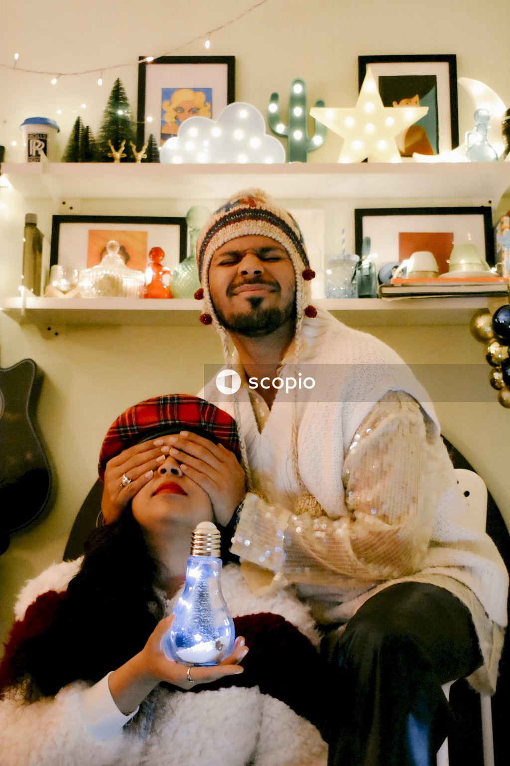 Man in white long sleeve shirt sitting beside woman in brown and white hijab
