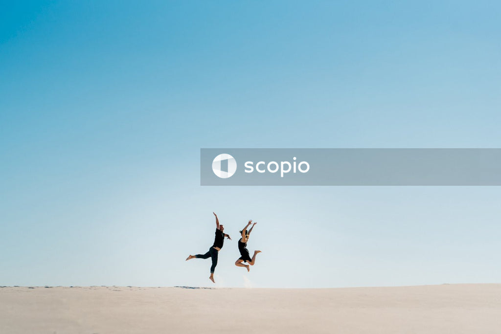 Man and woman jumping in the air