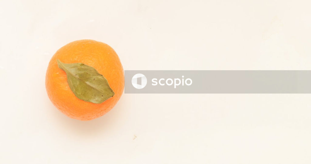 Orange fruit on white surface