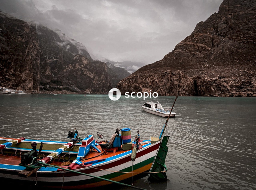 People riding on blue and red boat on body of water