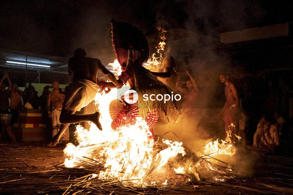 People performing religious dance near fire
