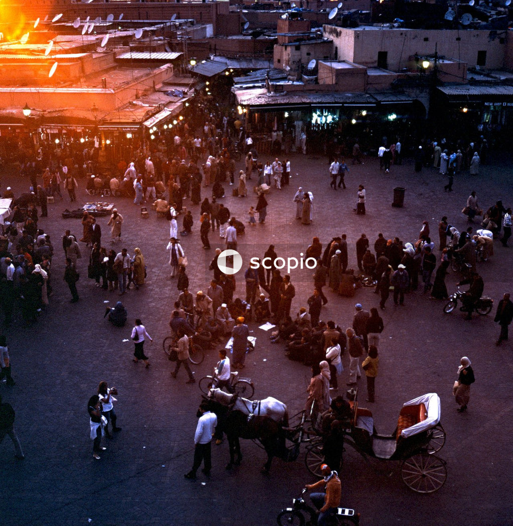 People walking on street during night time