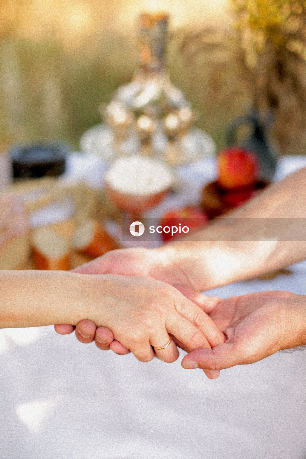 The man gently holds the woman's hand