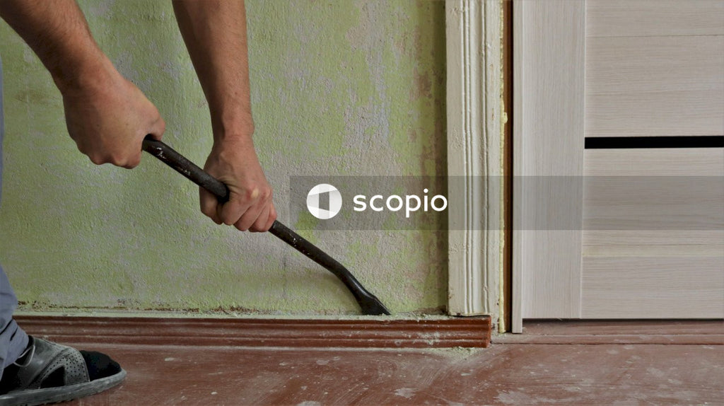 Person holding black handle tool