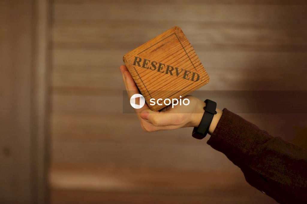 Person holding brown wooden board